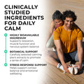 CALM Man and woman sitting on a wooden floor with text about clinically studied ingredients for daily calm.