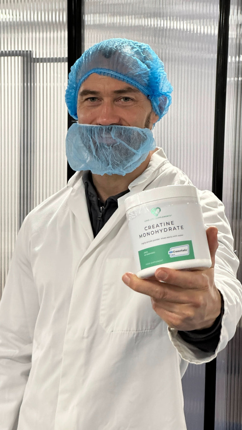 ben law Person in a lab setting holding a container labeled 'Creatine Monohydrate'.