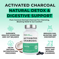 Activated charcoal supplement bottle with health benefits on a light green background